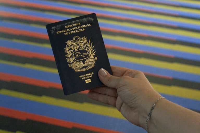 Woman showing venezuelan passportvin International Airport Simon Bolivar Maiquetia La Guaira Vargas State Venezuela.