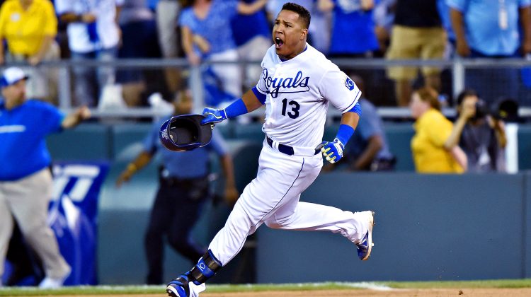 Sep 30, 2014; Kansas City, MO, USA; Kansas City Royals catcher Salvador Perez (13) reacts after hitting a walk-off single against the Oakland Athletics during the twelfth inning of the 2014 American League Wild Card playoff baseball game at Kauffman Stadium. The Royals won 9-8. Mandatory Credit: Peter G. Aiken-USA TODAY Sports
