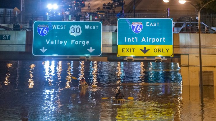 Kayakers paddel down a portion of Interstate 676 after flooding from heavy rains from hurricane Ida in Philadelphia, Pennsylvania on September 2, 2021 - Flash flooding caused by the remnants of Hurricane Ida killed at least 44 people in four northeastern US states overnight into Thursday, including several who perished in basements during the "historic" weather event officials blamed on climate change. (Photo by Branden Eastwood / AFP)