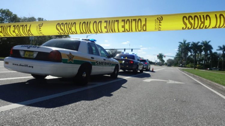 BROWARD, UNITED STATES - FEBRUARY 15: Police cordon off the area after the school shooting at Marjory Stoneman Douglas High School in Broward, Florida on February 15, 2018. At least 17 people were killed on February 14, 2018, when a lone gunman opened fire on a Florida high school, according to police. The victims are a mix of students and adults, officials said. (Photo by Carlos Miller/Anadolu Agency/Getty Images)