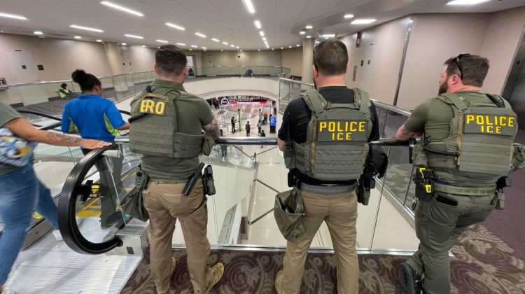 US Immigration and Customs Enforcement (ICE) agents stand watch near the departures hall at Hartsfield-Jackson Atlanta International Airport in Atlanta, Georgia on March 23, 2026. Immigration agents will be deployed in US airports beginning Monday, aiming to alleviate soaring congestion at security screenings amid a weeks-long budget standoff over President Donald Trump's mass deportation drive, officials said. (Photo by John Falchetto / AFP)