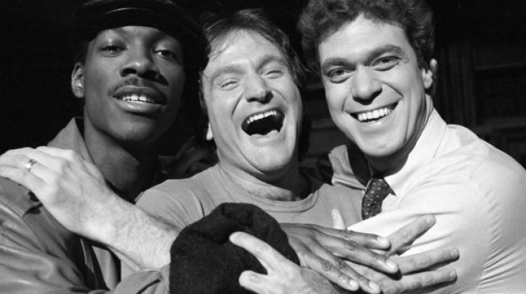 Robin Williams, center, takes time out from rehearsal at NBC's Saturday Night Live with cast members Eddie Murphy, left, and Joe Piscopo, Feb. 10, 1984.  Williams will appear as guest host on the show.  (AP Photo/Suzanne Vlamis)