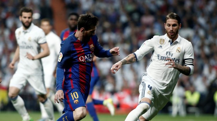 MADRID, SPAIN - APRIL 23:  Lionel Messi (L) of Barcelona in action against Sergio Ramos (R) of Real Madrid during the La Liga match between Real Madrid and Barcelona at Santiago Bernabeu Stadium in Madrid, Spain on April 23, 2017.


 (Photo by Burak Akbulut/Anadolu Agency/Getty Images)