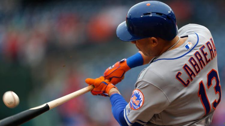 New York Mets Asdrubal Cabrera  hits an RBI single in the ninth inning of a baseball game against the Philadelphia Phillies allowing Eric Campbell to score, Saturday, Oct. 1, 2016, in Philadelphia. The Mets won 5-3 the secure the top National League wild card playoff spot (AP Photo/Laurence Kesterson) Mets Phillies Baseball