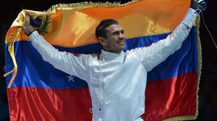 Venezuela's Ruben Limardo celebrates his victory over Norway's Bartosz Piasecki  at the end of their Men's epee gold medal bout as part of the fencing event of London 2012 Olympic games, on August 1,  2012 at the ExCel centre in London AFP PHOTO / ALBERTO PIZZOLI        (Photo credit should read ALBERTO PIZZOLI/AFP/GettyImages)