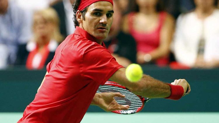 Switzerland's Federer returns a ball during his Davis Cup semi-final tennis match against Italy's Fognini at the Palexpo in Geneva