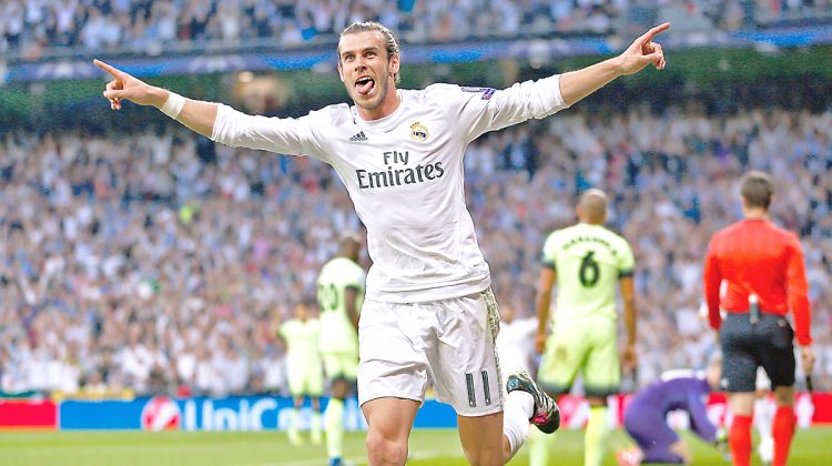 Real Madrid's Gareth Bale celebrates after scoring the opening goal during the Champions League semifinal second leg soccer match between Real Madrid and Manchester City at the Santiago Bernabeu stadium in Madrid, Wednesday May 4, 2016. (AP Photo/Francisco Seco)