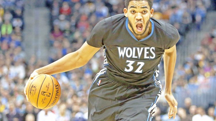 Oct 30, 2015; Denver, CO, USA; Minnesota Timberwolves center Karl-Anthony Towns (32) drives to the basket during the first half against the Denver Nuggets at Pepsi Center. Mandatory Credit: Chris Humphreys-USA TODAY Sports
