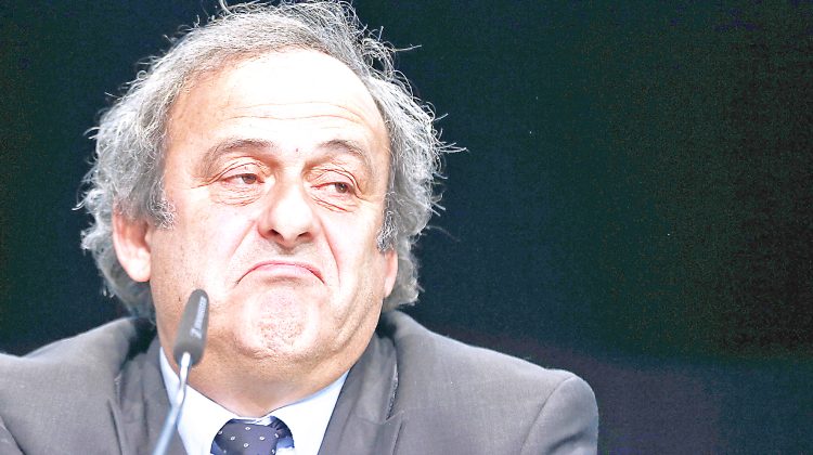 FILE - In This May 28, 2015 file photo UEFA president Michel Platini grimaces during a press conference following a meeting of the UEFA board ahead of the FIFA congress in a hotel in Zurich, Switzerland. The Court of Arbitration for Sport, CAS, in Lausanne, Switzerland, plans to announce its verdict on Monday, May 9, 2016 in Michel Platini's appeal on his six-year ban from football.  (AP Photo/Michael Probst, file)