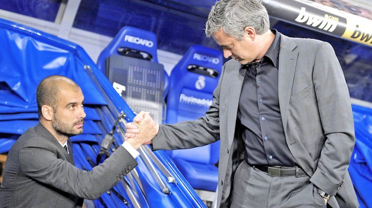 File photo of Real Madrid's coach Mourinho and Barcelona's coach Guardiola before the start of their Spanish first division soccer match at Santiago Bernabeu stadium in Madrid