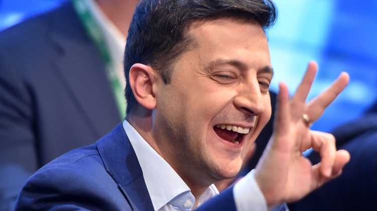 Ukrainian comedian and presidential candidate Volodymyr Zelensky reacts after the announcement of the first exit poll results in the second round of Ukraine's presidential election at his campaign headquarters in Kiev on April 21, 2019. (Photo by Sergei GAPON / AFP)