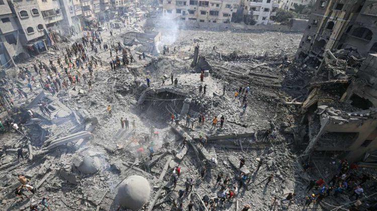 TOPSHOT - Palestinians inspect the damage following an Israeli airstrike on the Sousi mosque in Gaza City on October 9, 2023. Israel continued to battle Hamas fighters on October 9 and massed tens of thousands of troops and heavy armour around the Gaza Strip after vowing a massive blow over the Palestinian militants' surprise attack. (Photo by Mahmud HAMS / AFP) (Photo by MAHMUD HAMS/AFP via Getty Images)