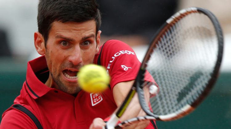 FILE - In this June 3, 2016, file photo, Serbia's Novak Djokovic returns the ball to Austria's Dominic Thiem during their semifinal match of the French Open tennis tournament at the Roland Garros stadium, in Paris. The U.S. Open tennis tournament begins Monday, Aug. 29. (AP Photo/Michel Euler, File) US Open Tennis Mens Capsules