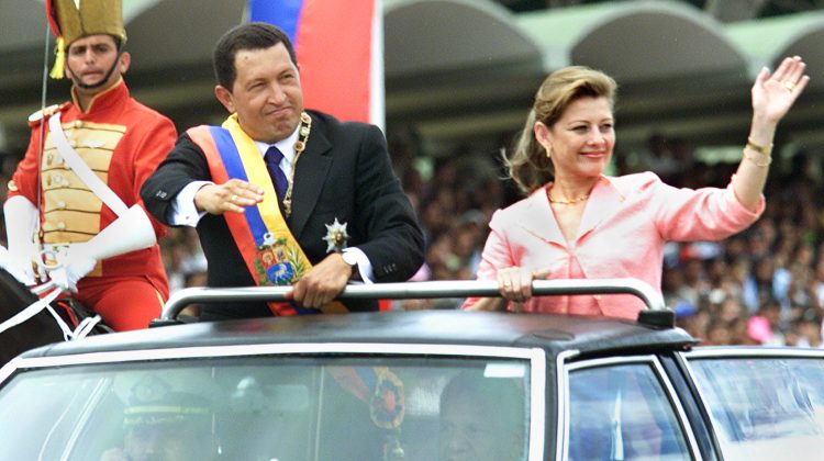 Venezuelan President Hugo Chavez (C) and wife Marisabel (L) wave to supporters during the country's independence day military parade in Caracas, July 5, 2001. Chavez urged other nations to "understand and respect" his revolutionary government, which he said faced malicious and ignorant criticism at home and abroad.

KW/HK - RTRKF7F