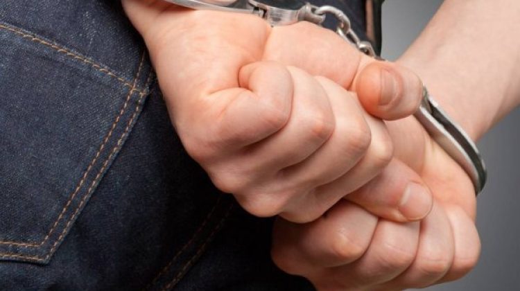 depositphotos_129207094-stock-photo-man-in-handcuffs-behind-his