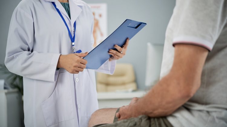 Medical practitioner asking patient questions from the list