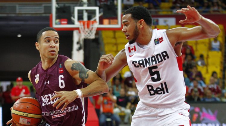 Venezuela's Heissler Guillent (6) is defended by Canada's Cory Joseph during their FIBA Americas Championship basketball game in Caracas September 6, 2013. REUTERS/Carlos Garcia Rawlins (VENEZUELA - Tags: SPORT BASKETBALL)